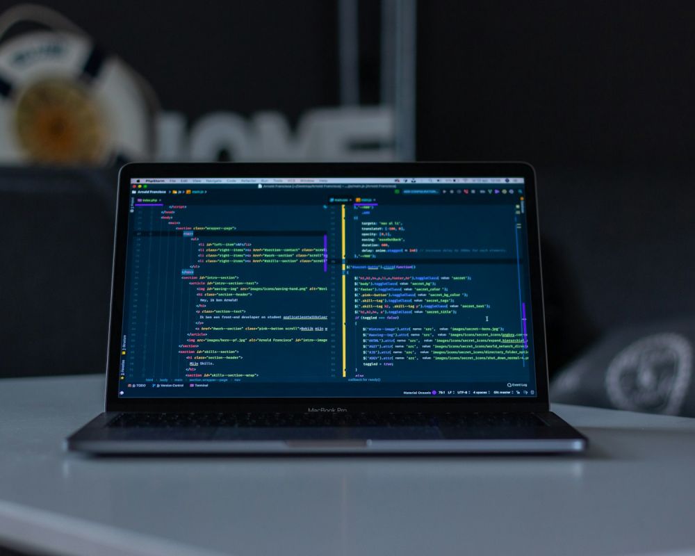 Laptop showing code on a desk