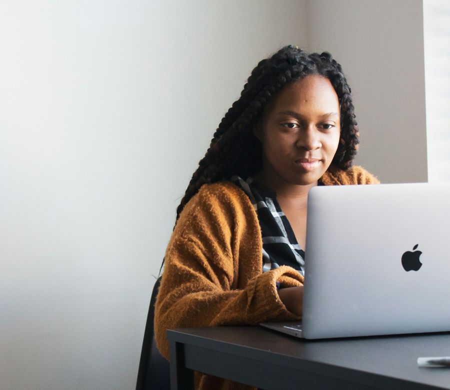 Woman working on her laptop at a desk